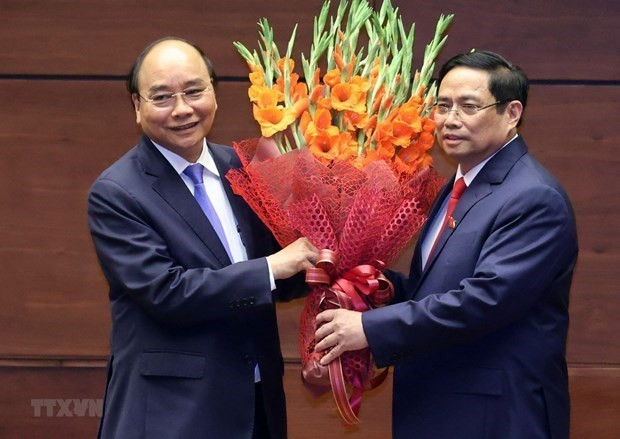 国家主席阮春福(左)与政府总理范明政(右)。图自越通社 外国领导人发来贺电贺函 祝贺越南新上任的领导人 ảnh 1