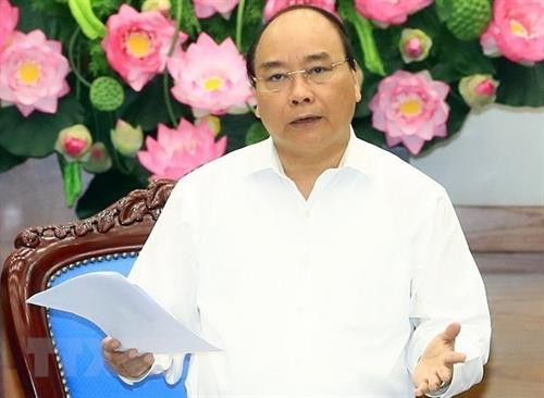 阮春福在会上发表讲话。图自越通社