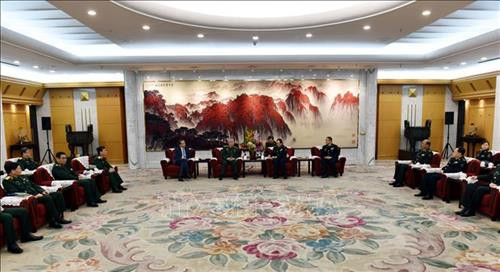 工作会谈场景。图自越通社