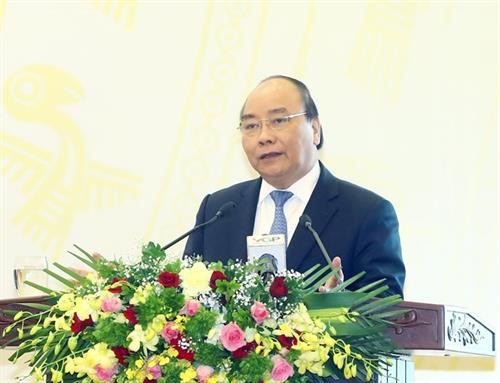 阮春富在会上发言。（图片来源：越通社）