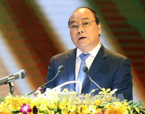 阮春福在表彰大会上发表讲话。（图片来源：越通社）