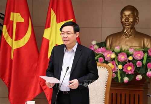 王廷惠发表讲话。图自越通社