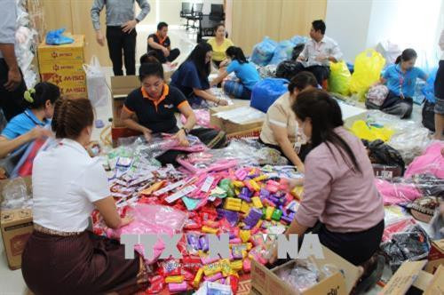 资料图：越南企业继续向老挝水电站溃坝事故灾民提供援助