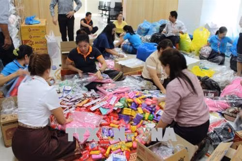 资料图：越南企业继续向老挝水电站溃坝事故灾民提供援助