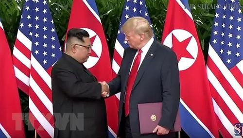 美国总统唐纳德·特朗普（右）与朝鲜最高领导人金正恩（左）。（图片来源：韩联社）