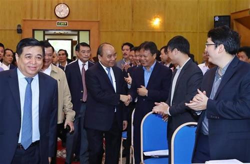越南政府总理阮春福19日会见计划投资部主要领导代表。图自越通社