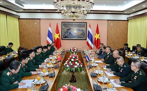 双方会谈场景。图自越通社