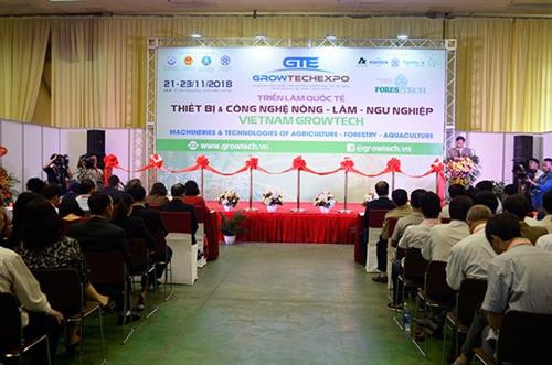 2018年越南农、林、渔业机械设备及产品加工技术展览会开幕式场景。 图自越通社