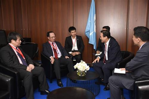 越南公安部副部长阮文成与INTERPOL主席金正阳举行会晤。图自越通社