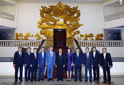 双方代表合影。图自越通社