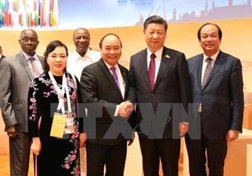 阮春福与中国国家主席习近平。（图片来源：越通社）