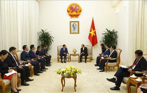 张和平会见蒙古国法律和内务部长尼亚木道尔吉。图自越通社