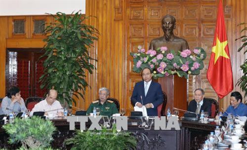 政府总理阮春福会见越南橙剂受害者协会代表 ảnh 1