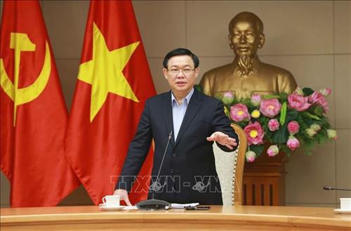 王廷惠发表讲话。图自越通社