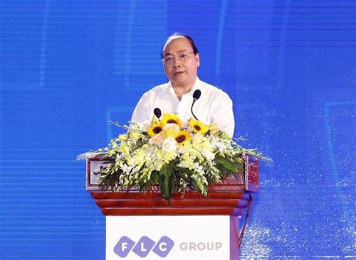 阮春福在会议上发言。图自越通社