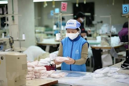 资料图：越南出口近4.16万只口罩 。图自越通社