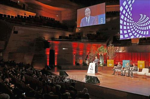 阮春福在会上发表讲话。图自越通社