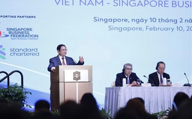 越南政府总理范明政出席越新企业论坛