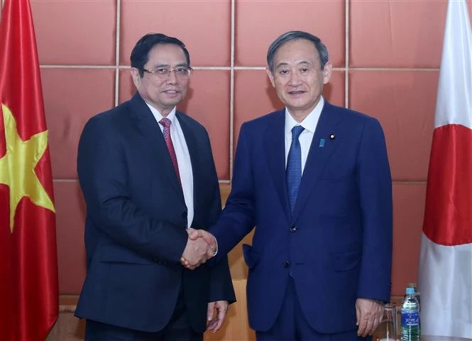 越共中央组织部部长、越日友好议员小组组长会见日本首相菅义伟