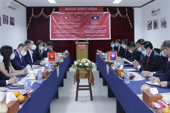 越共中央宣教部高级代表团访老的相关活动