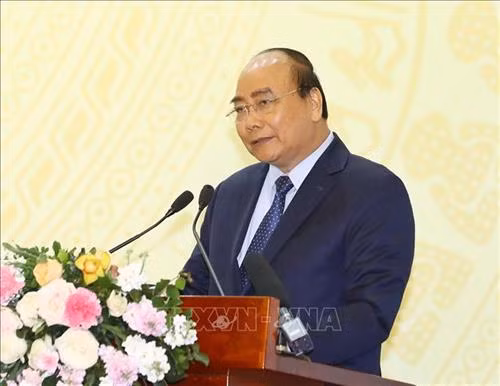 政府总理阮春福在论坛上发表讲话。图自越通社