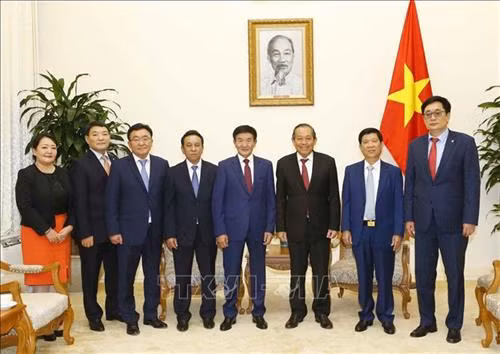 双方代表合影。图自越通社