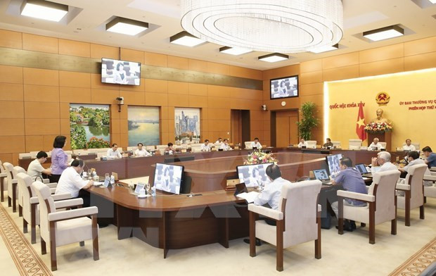 会议场景。图自越通社 国会常委会第48次会议:将提请国会第十次会审议撤销范富国国会代表资格 ảnh 2