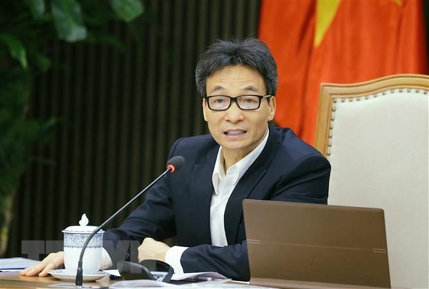 越南政府副总理武德儋主持会议。图自越通社 越南预计于2021年第三季度末推出国产疫苗 ảnh 1