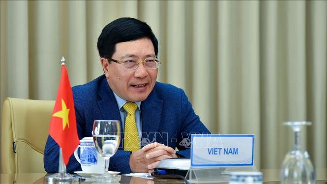 越南政府副总理兼外长范平明 图自越通社 越南政府副总理兼外长范平明与委内瑞拉外长豪尔赫·阿雷亚萨举行视频会谈 ảnh 1