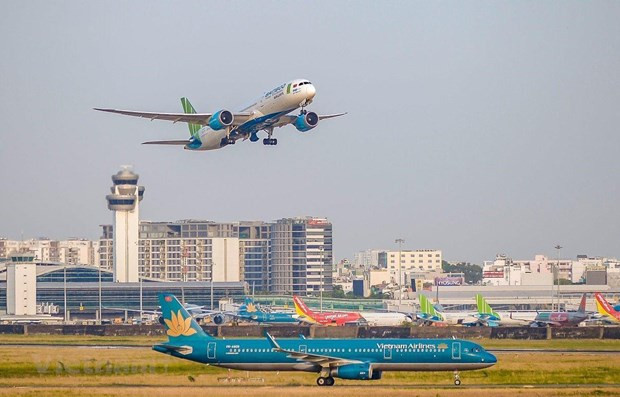 附图 图自越通社 恢复人民往来和旅游时需确保疫情防控需求 ảnh 1