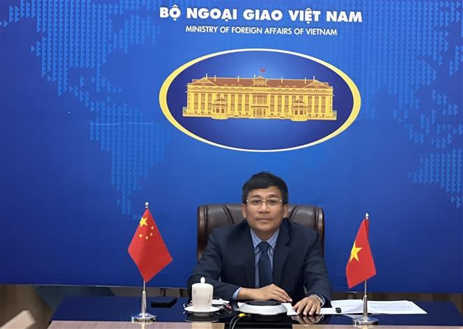 外交部常务副部长、越中双边合作指导委员会越方秘书长阮明宇发表讲话。图自越通社 越中双边合作指导委员会双方秘书长举行视频会晤 ảnh 1
