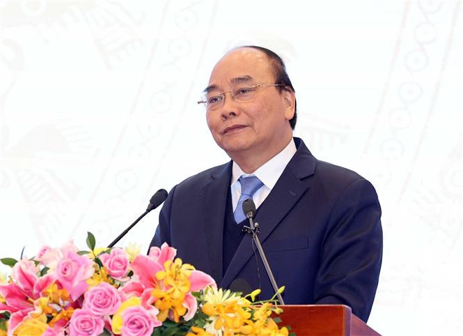 阮春福在会议上发表讲话。图自越通社 越南政府总理阮春福:致力解决法律系统中的交叉、矛盾问题 ảnh 2