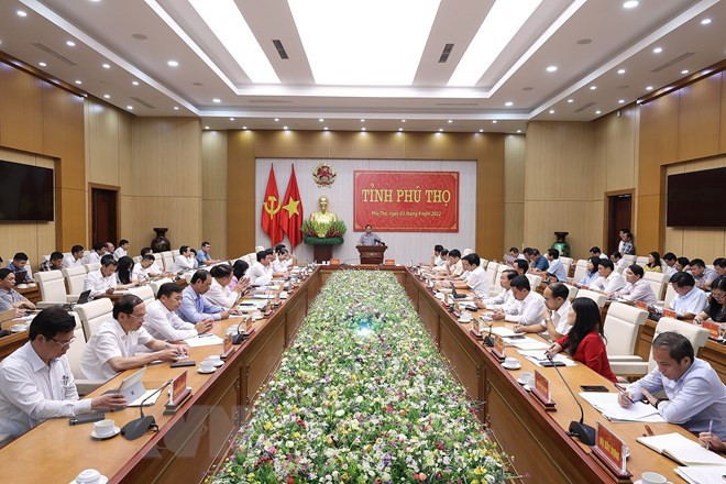 会议场景。图自越通社 政府总理范明政:建设富寿成为链接越南和东盟与中国西南地区的经济枢纽中心 ảnh 1