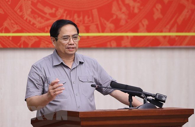 越南政府总理范明政发表讲话。图自越通社 政府总理范明政:建设富寿成为链接越南和东盟与中国西南地区的经济枢纽中心 ảnh 2