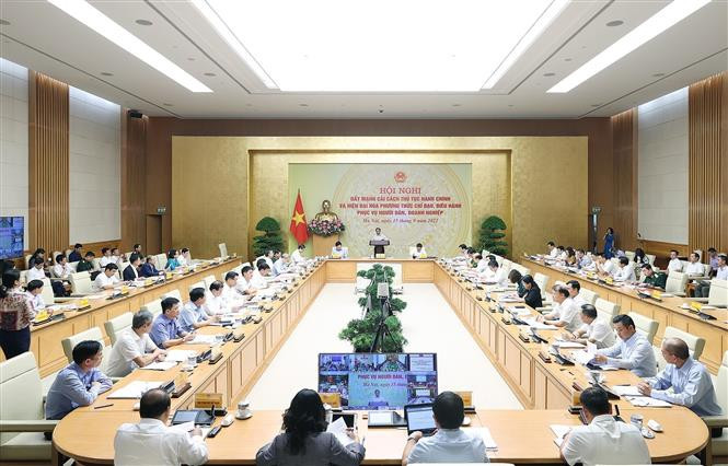 会议场景。图自越通社 政府总理范明政主持召开行政改程序改革全国视频会议 ảnh 2