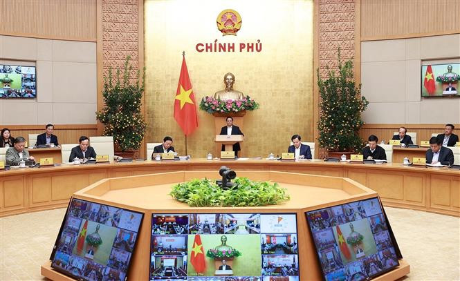 政府例行会议场景。图自越通社 范明政总理主持召开2023年1月政府例行会议 ảnh 1