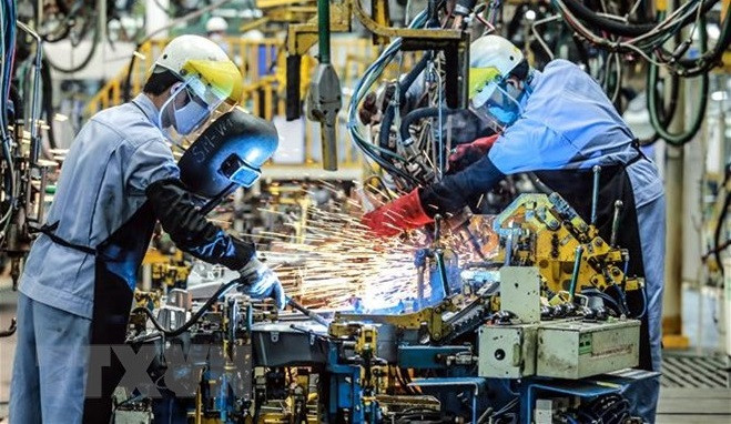 外资企业生产活动。图自越通社 瑞士报刊:越南成为外国公司的新目的地 ảnh 1