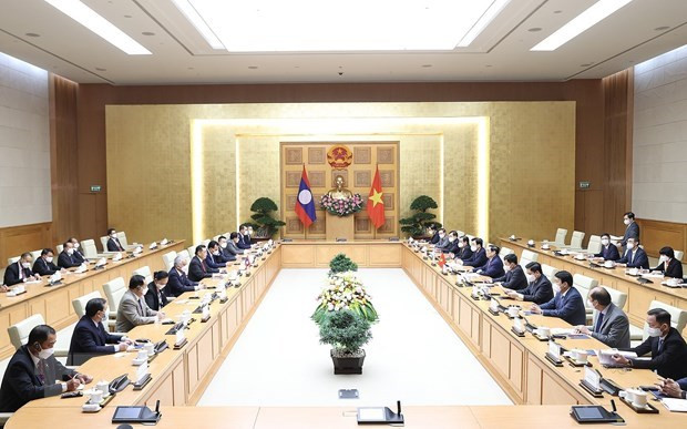 会见场景。图自越通社 越南政府总理范明政会见老挝国会主席赛宋蓬·丰威汉 ảnh 2