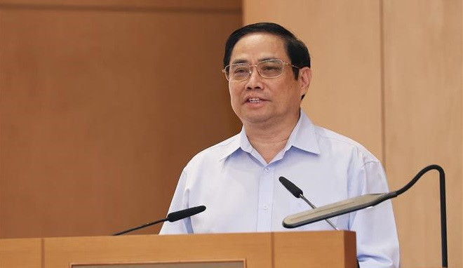 范明政在会上发表讲话。图自越通社 政府总理范明政:建设创新型、廉政型、行动型、高效型、服务型的第十五届政府 ảnh 1