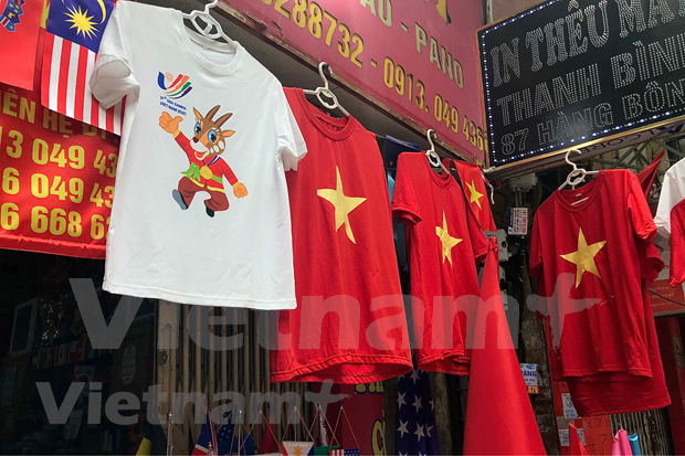 越南人通过纪念品为东运会加油打气。图自越通社 越南人通过纪念品为东运会加油打气 ảnh 1