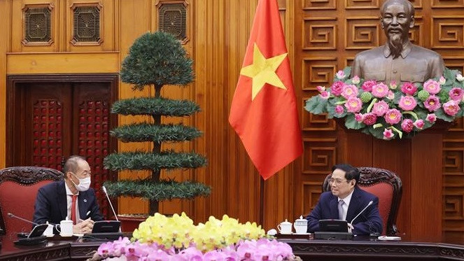 越南政府总理范明政会见世卫组织西太平洋地区主任葛西健 ảnh 1