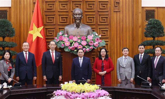 越南政府总理范明政会见世卫组织西太平洋地区主任葛西健 ảnh 2