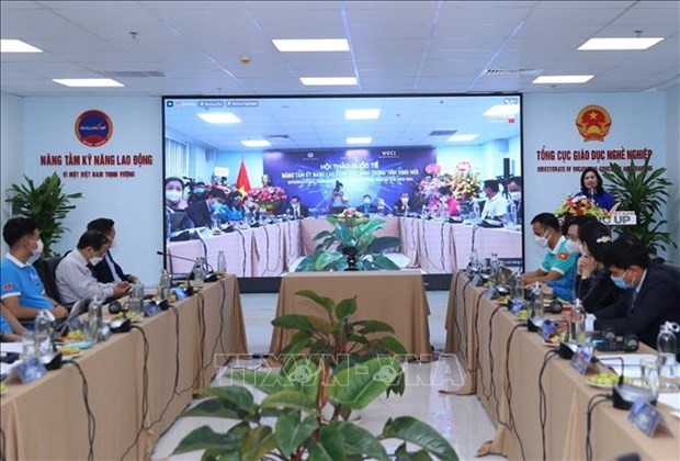 国际研讨会场景。图自越通社 在新形势下提高越南劳动技能 ảnh 1