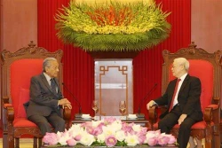 越共中央总书记、国家主席阮富仲会见马来西亚总理马哈蒂尔