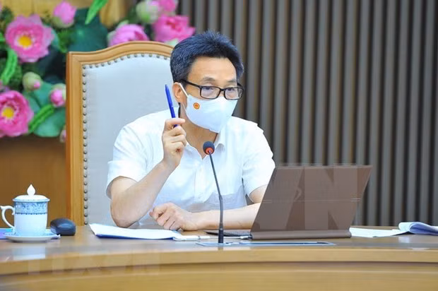 胡志明市部署机器人自动打电话询问市民健康状况和及时进行核酸检测 ảnh 1