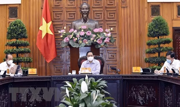 政府总理范明政：全民同心协力抗击疫情 ảnh 2