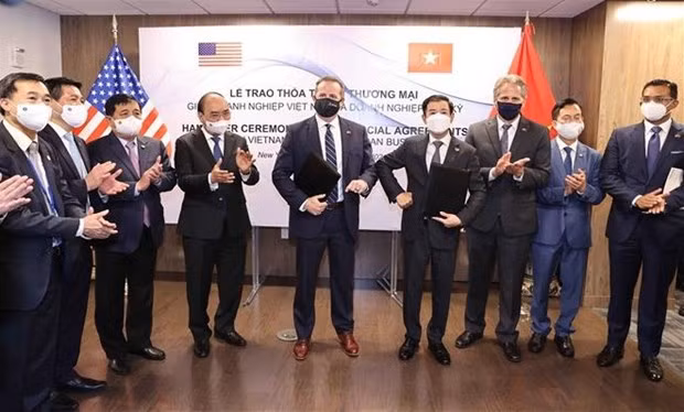 越南国家主席阮春福出席越美公司合作协议文本互换仪式 ảnh 1