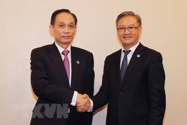 越共中央对外部长：将越老“同志加兄弟”传统友谊维护好、传承好 ảnh 1