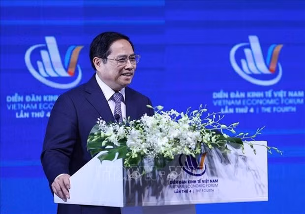 越南政府总理范明政：越南坚定革新开放，主动积极深度融入国际社会 ảnh 1