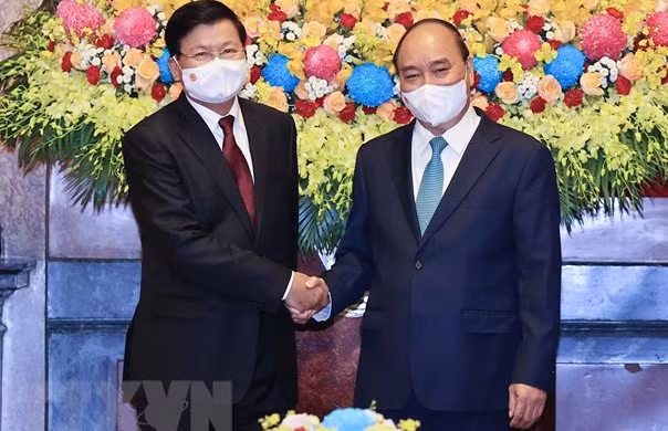 老挝领导访越之旅是两个民族的新历史里程碑 ảnh 1